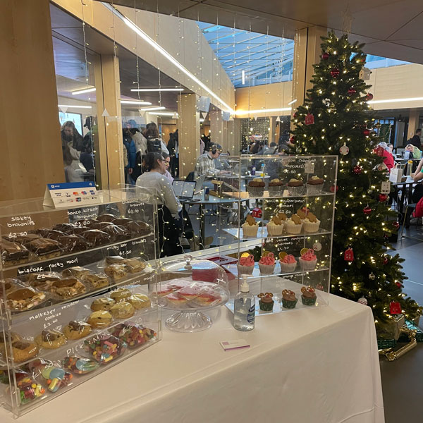 A festive market stall with lots of cupcakes