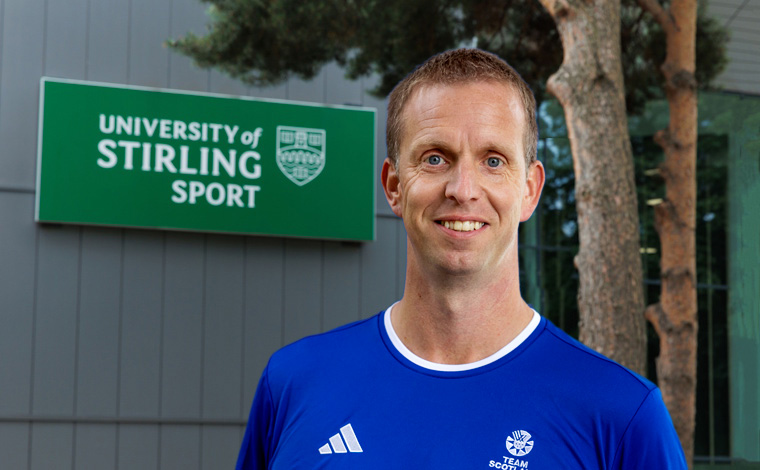 Brad Hay in front of University of Stirling Sport sign.