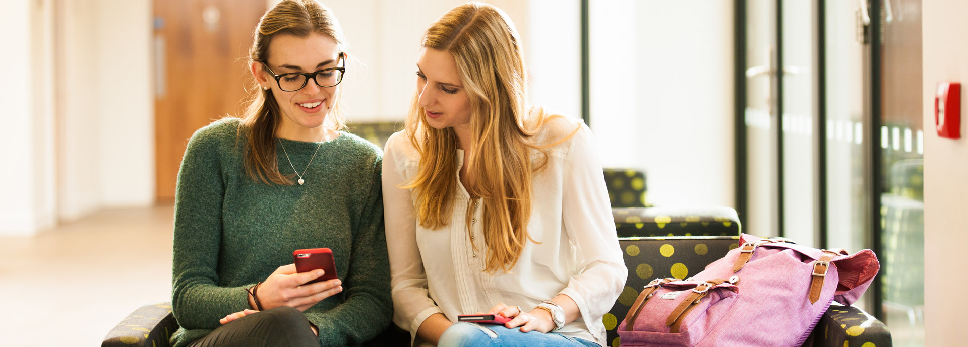 Students looking at mobile phone