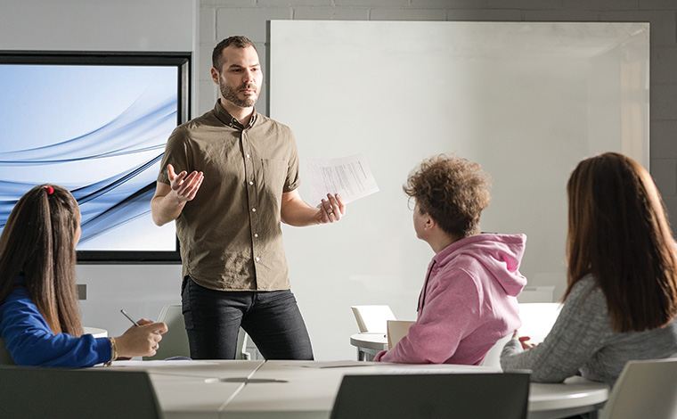 A tutor teaching a small group of students