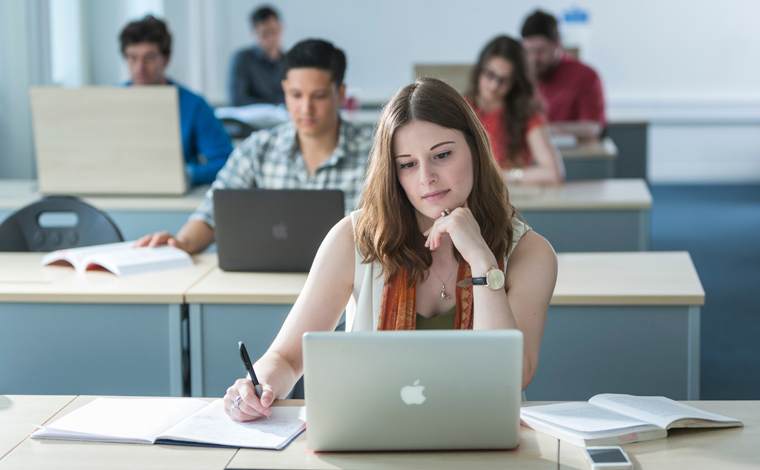 student studying in library