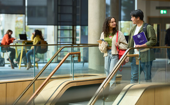 Students going down stairs at Campus Central