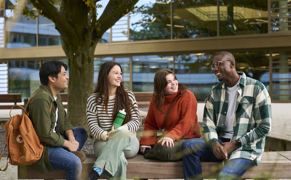 Students sitting in Queens Court