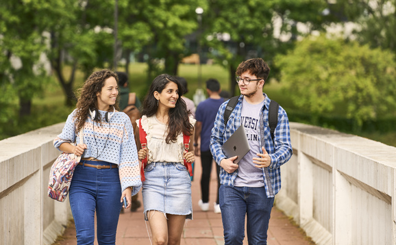 Students walking on the link bridge