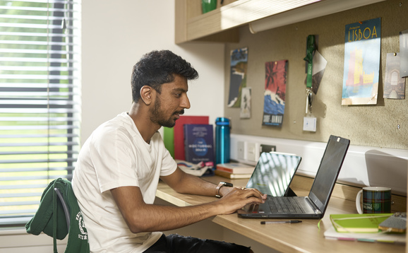 Student looking at a laptop