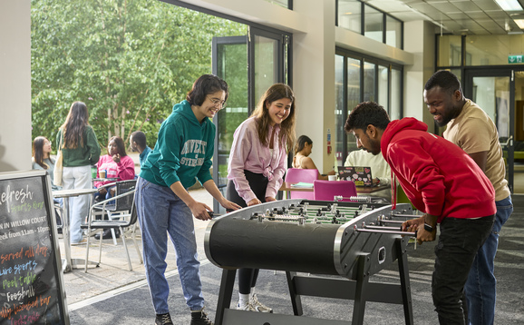 Students playing table football