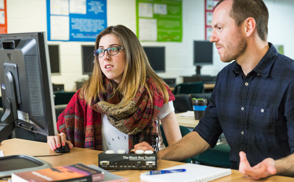 man and woman at computer