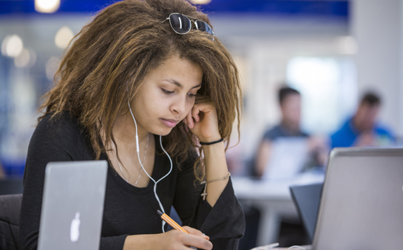 student studying with laptop