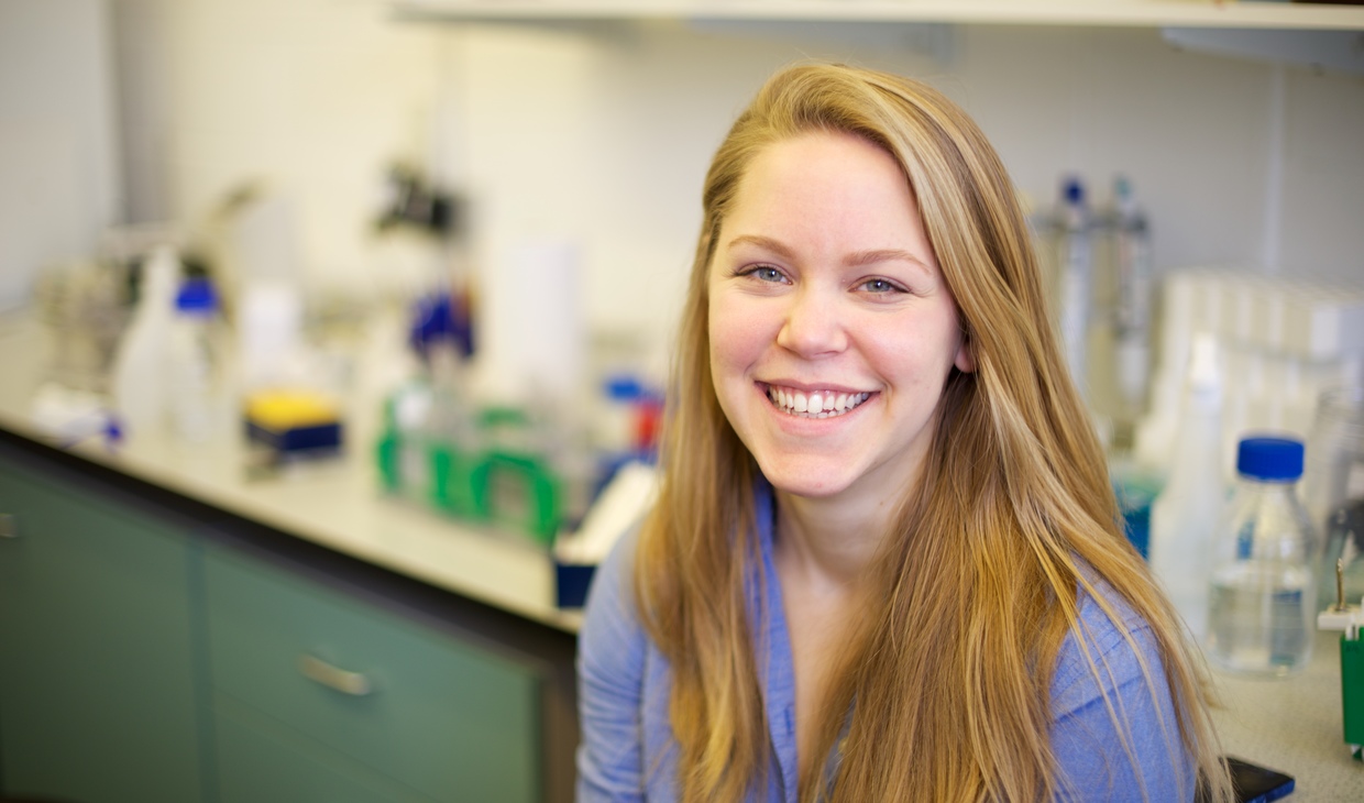 student smiling in lab