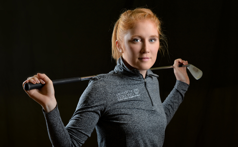 stirling student with golf club