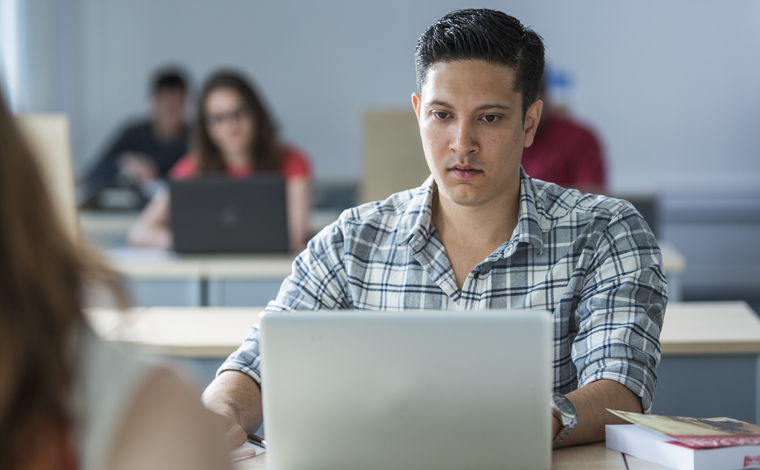 student studying with laptop