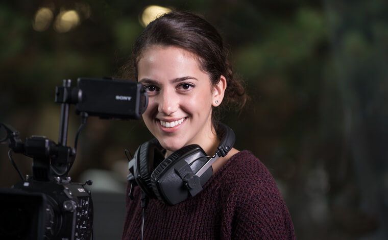 Female student with tv camera