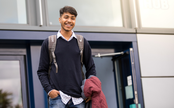 Student outside Queen's Court entrance