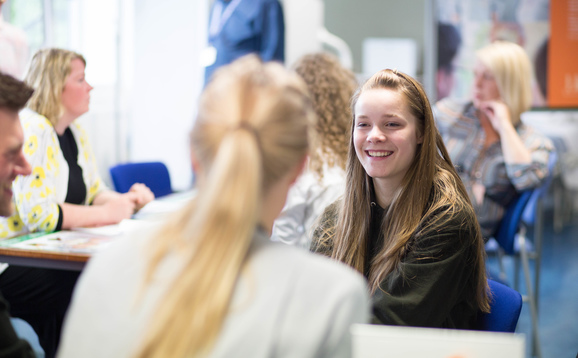 Prospective student speaking to another student at open day