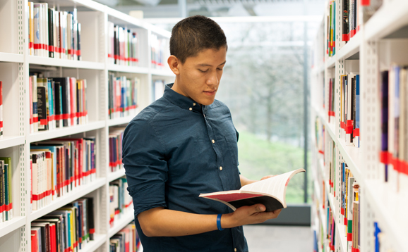 student reading in library