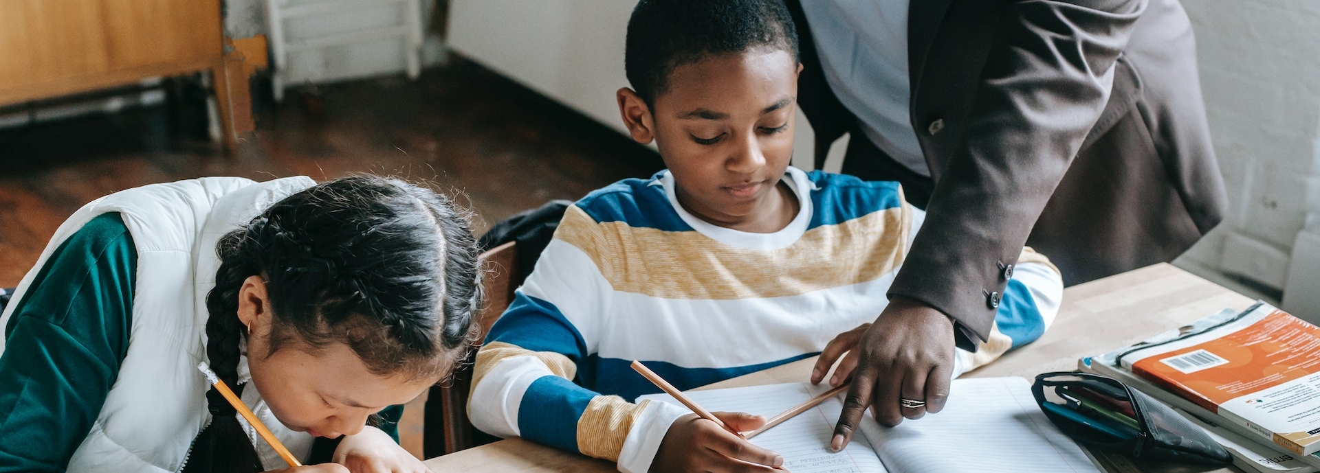 Girl and boy at desk at school