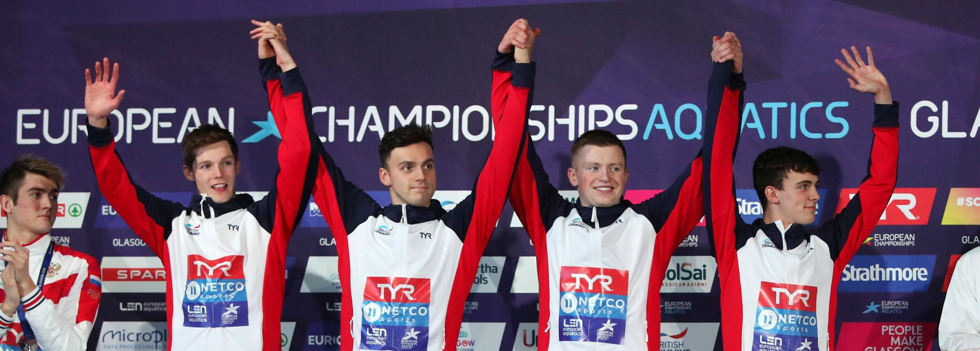 Duncan Scott celebrates with GB teammates on podium