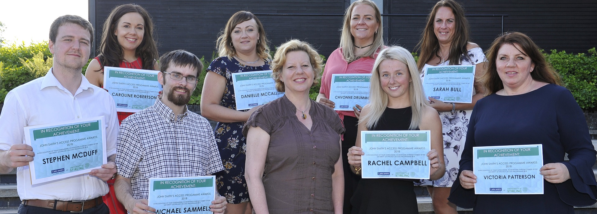 Group of students with certificates