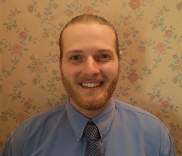 Head and shoulders photo of Politics student Jacob Robinett smiling to camera