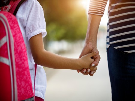 Two children holding hands