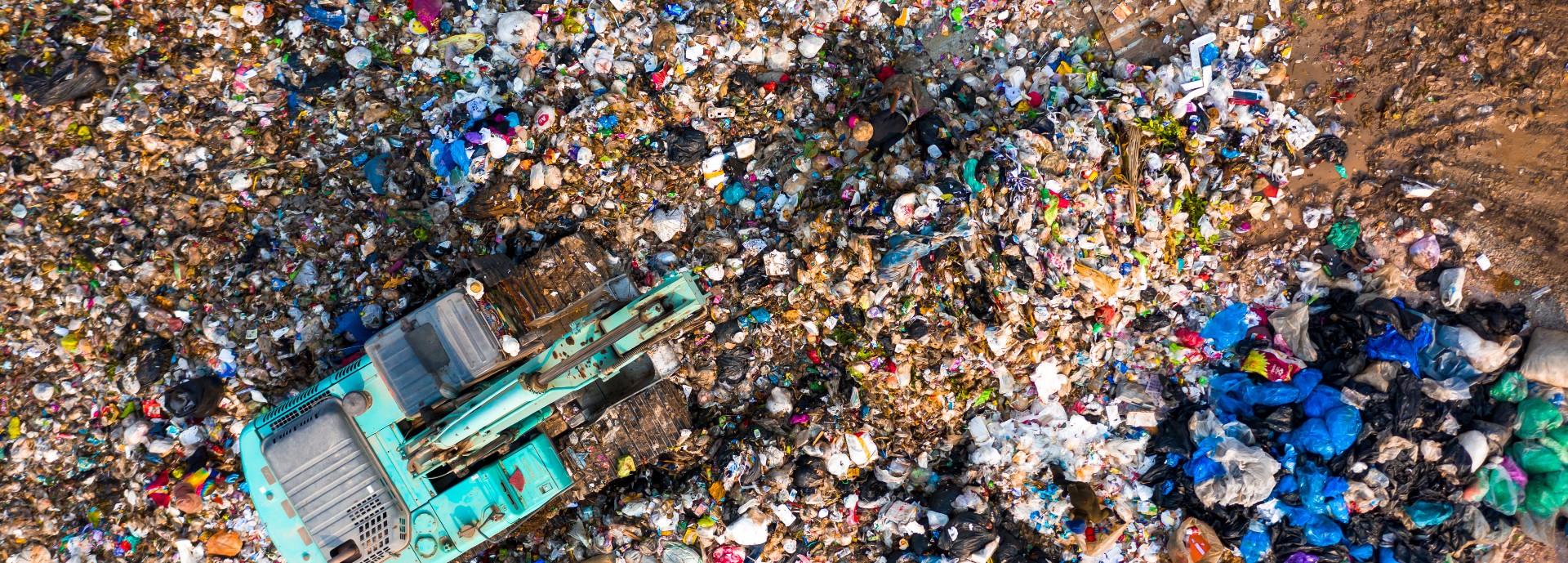 Digger at landfill site