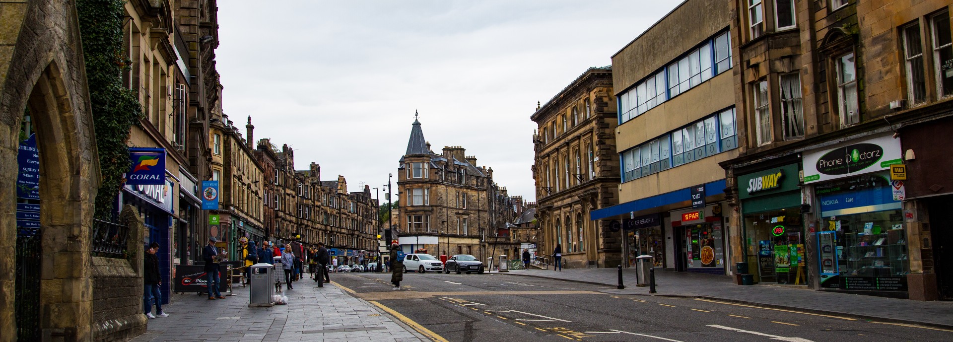 Medieval village street with modern shops in Stirling, Scotland, United Kingdom