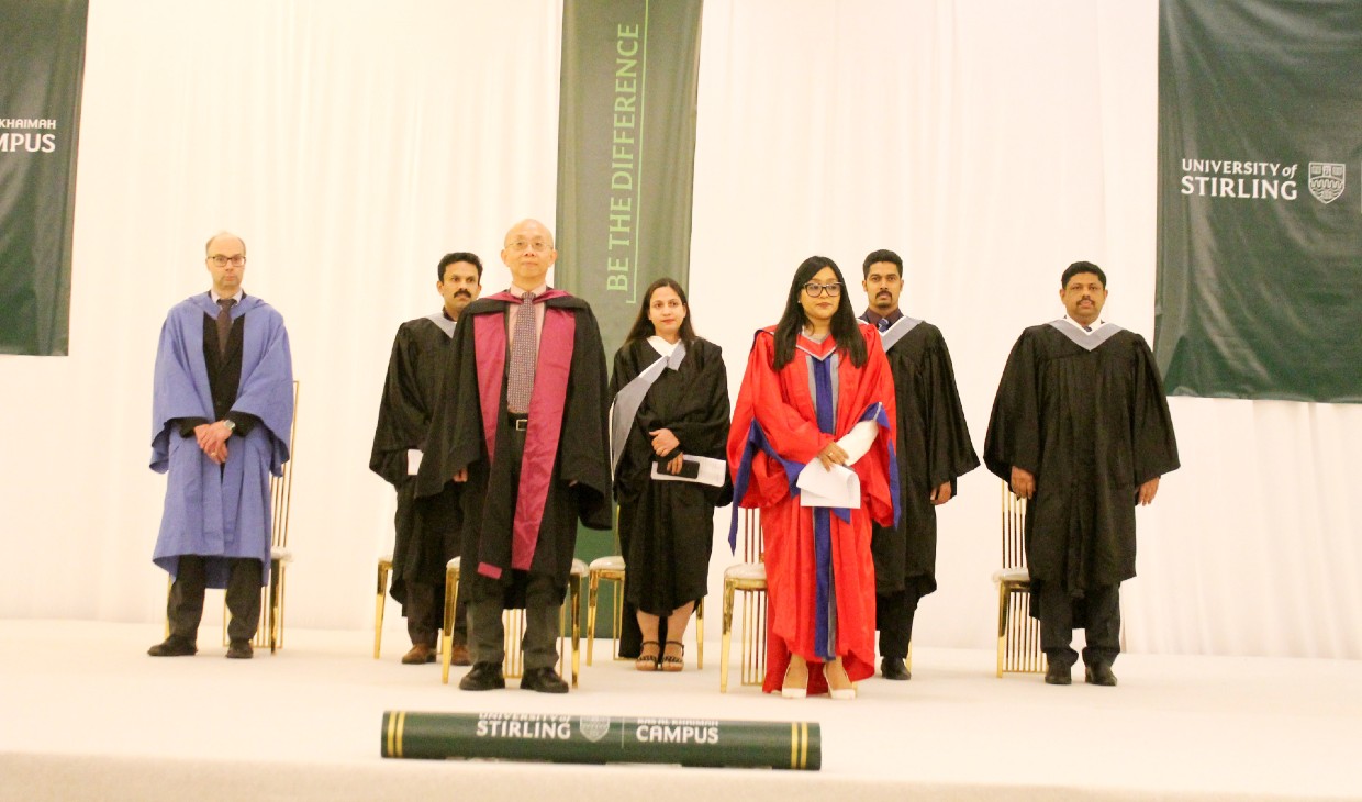 Staff from Stirling's RAK and Stirling campuses on stage at the graduation celebration event