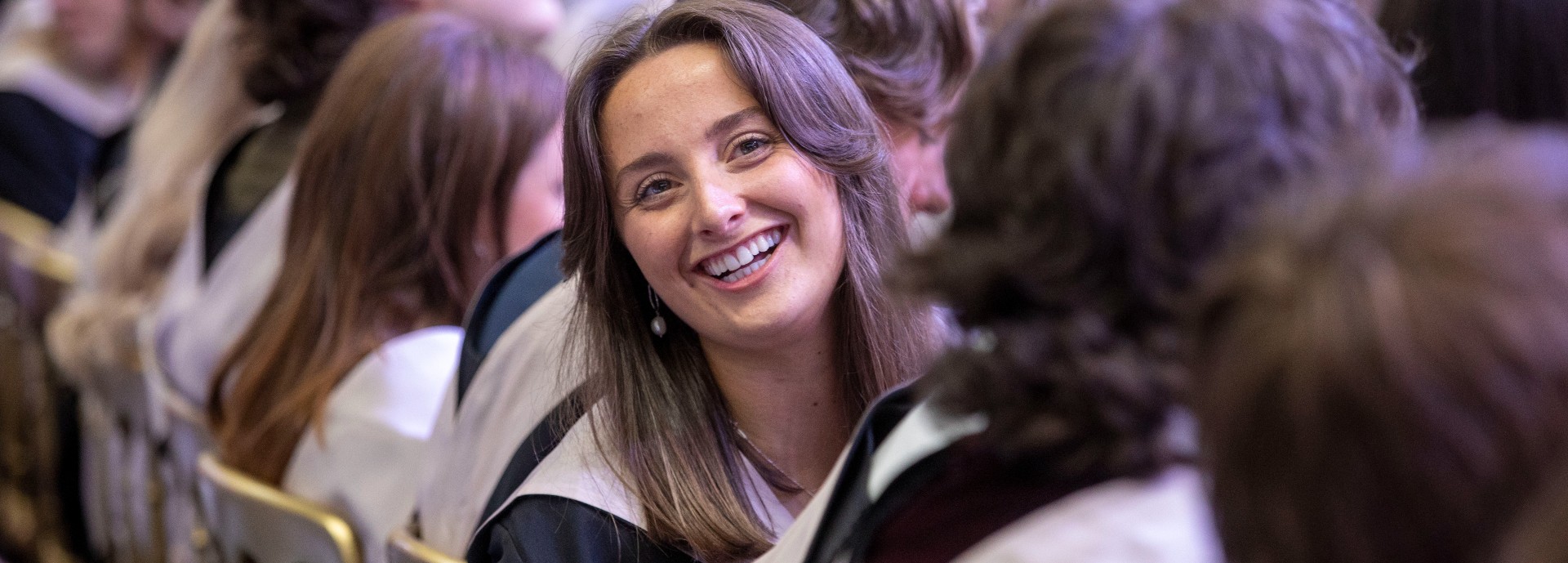 Graduands in graduation hall