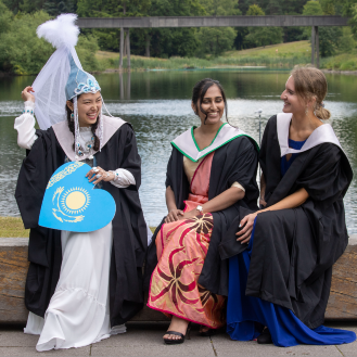 Kazakhstan national dress graduate with friends