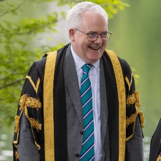 Chancellor and Principal chat next to the loch