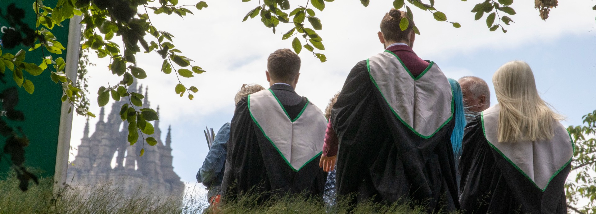 Graduates walk towards Wallace Monument.