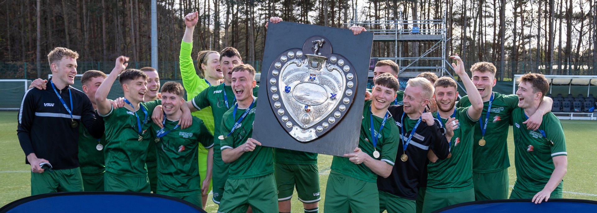 University of Stirling footballers lift the Queen's Park Shield.