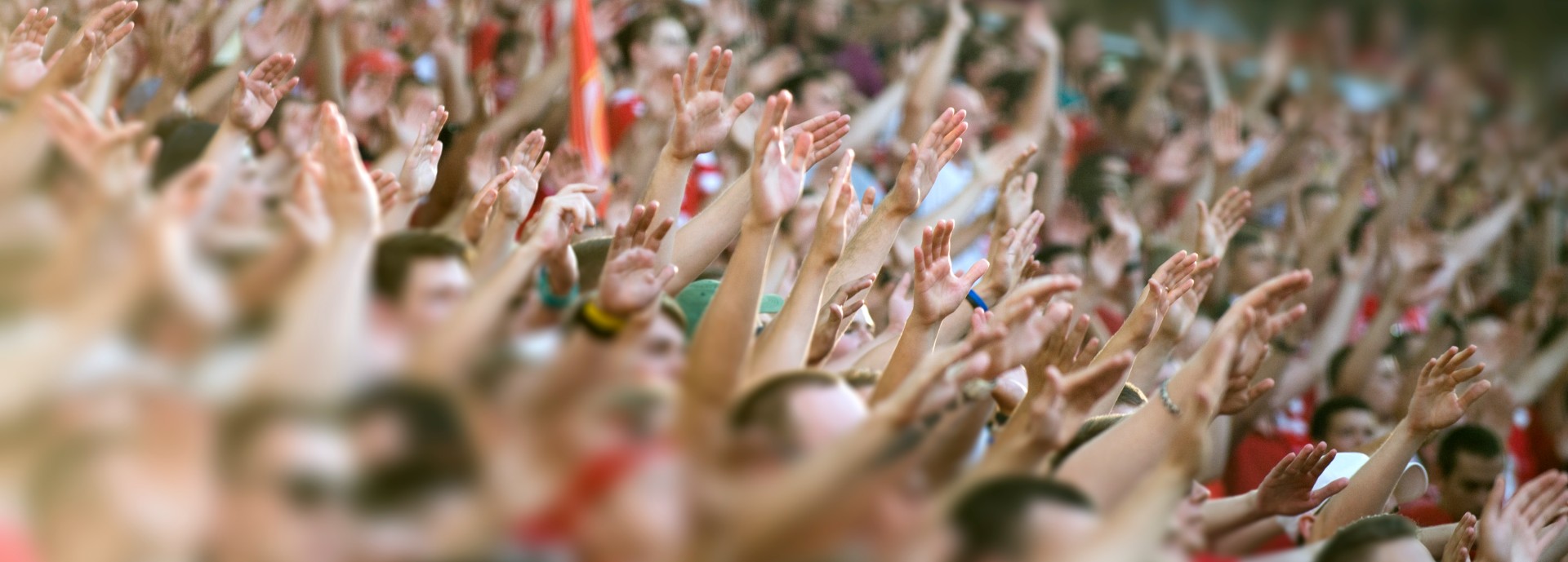 Crowd clapping on the podium of the stadium