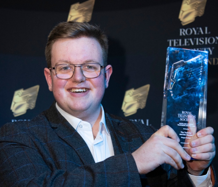 Gregor Forbes poses with his award trophy