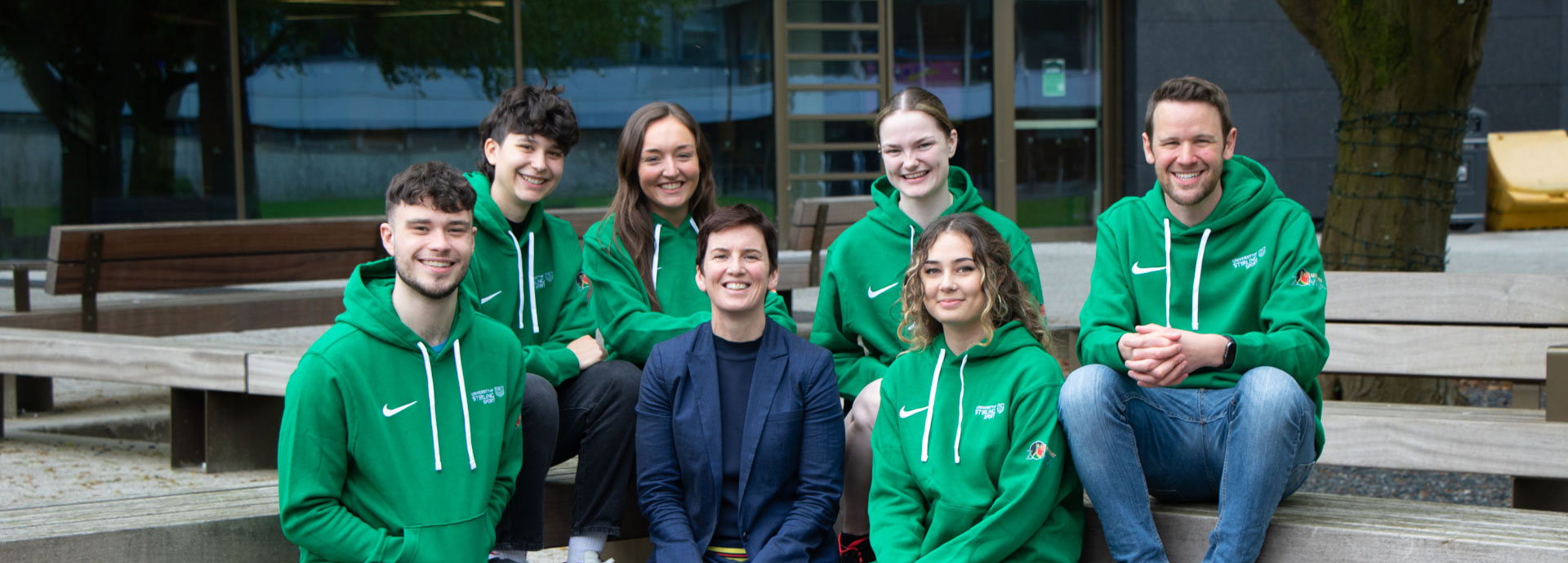 Volunteer Zambia Student Volunteers sit with Cathy Gallagher, Executive Director of Sport