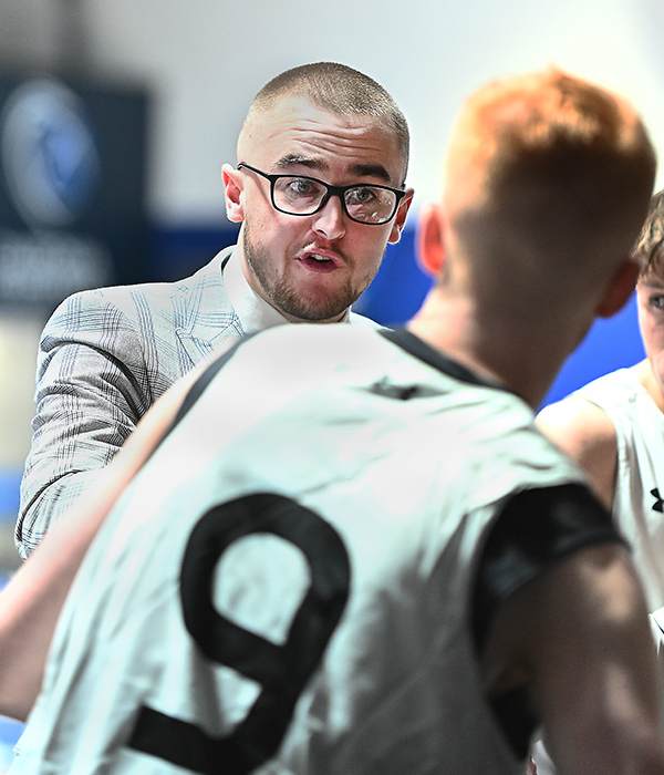 Player/Coach Cameron Stewart talks to the players during the match