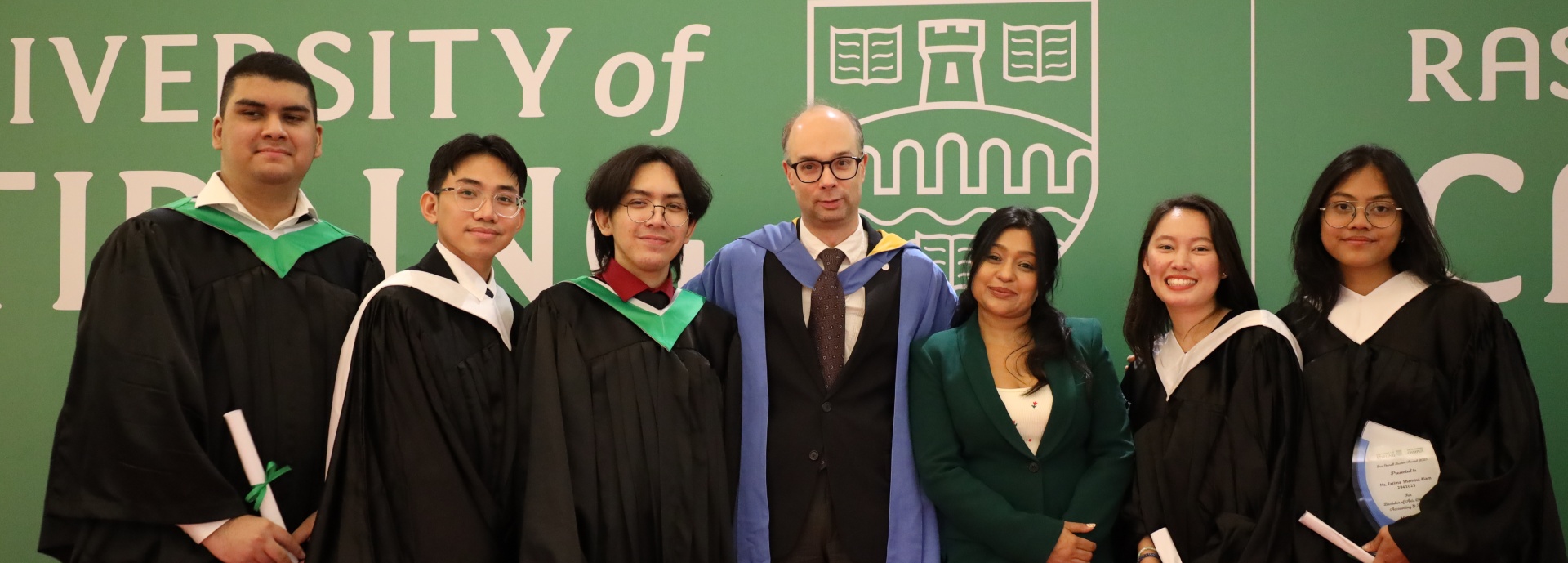 Students at the University of Stirling's UAE campus celebrate their graduation.