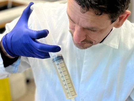 Dr Xavier Alexis Walter, a senior researcher in water and wastewater management in a circular economy at The James Hutton Institute in Aberdeen, feeding his experiment.