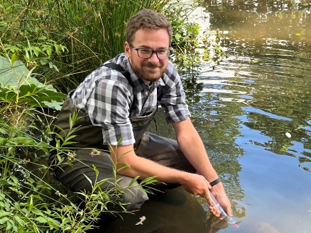 Dr Alan Law using sampling kit at the University of Stirling campus