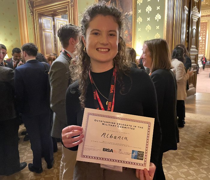 Jenna Carty is photographed in the Foreign Office holding her certificate