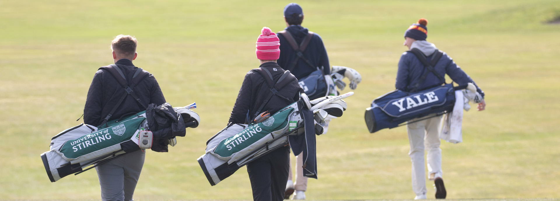 Stirling and Yale golfers walking on course