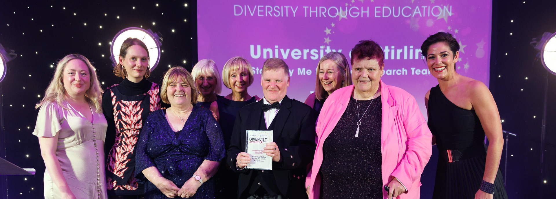 The Stand by Me team on stage at the award ceremony