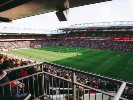 football pitch with spectators on stands