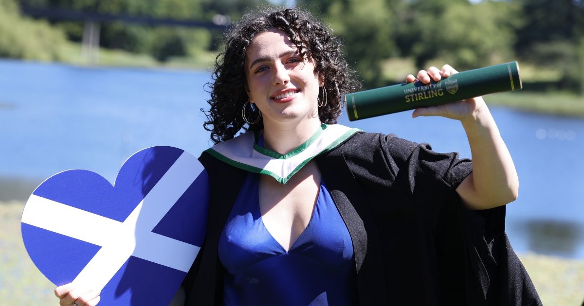 Rugby international Holland Bogan stands lochside.