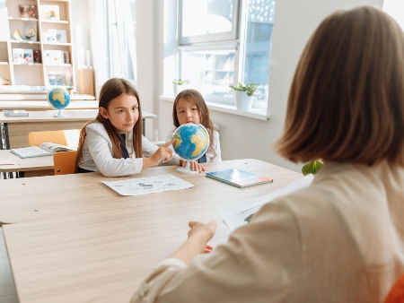 pupils and teacher in classroom