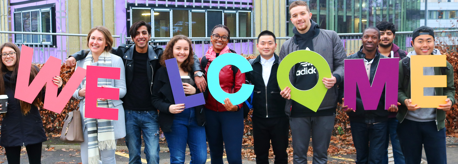 students holding welcome sign