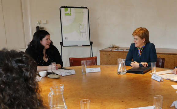 Dr Katie Boyle talking to the First Minister