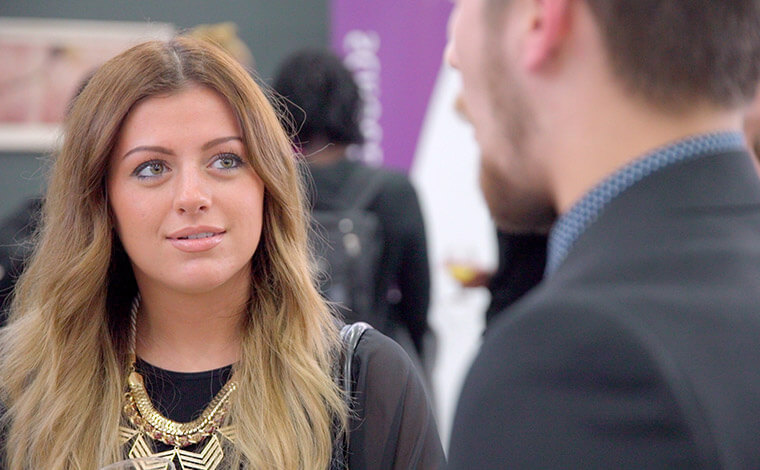 A student attending a business event