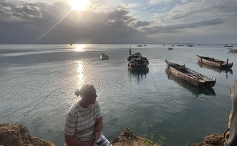 Student nurse in Tanzania watching a sunset