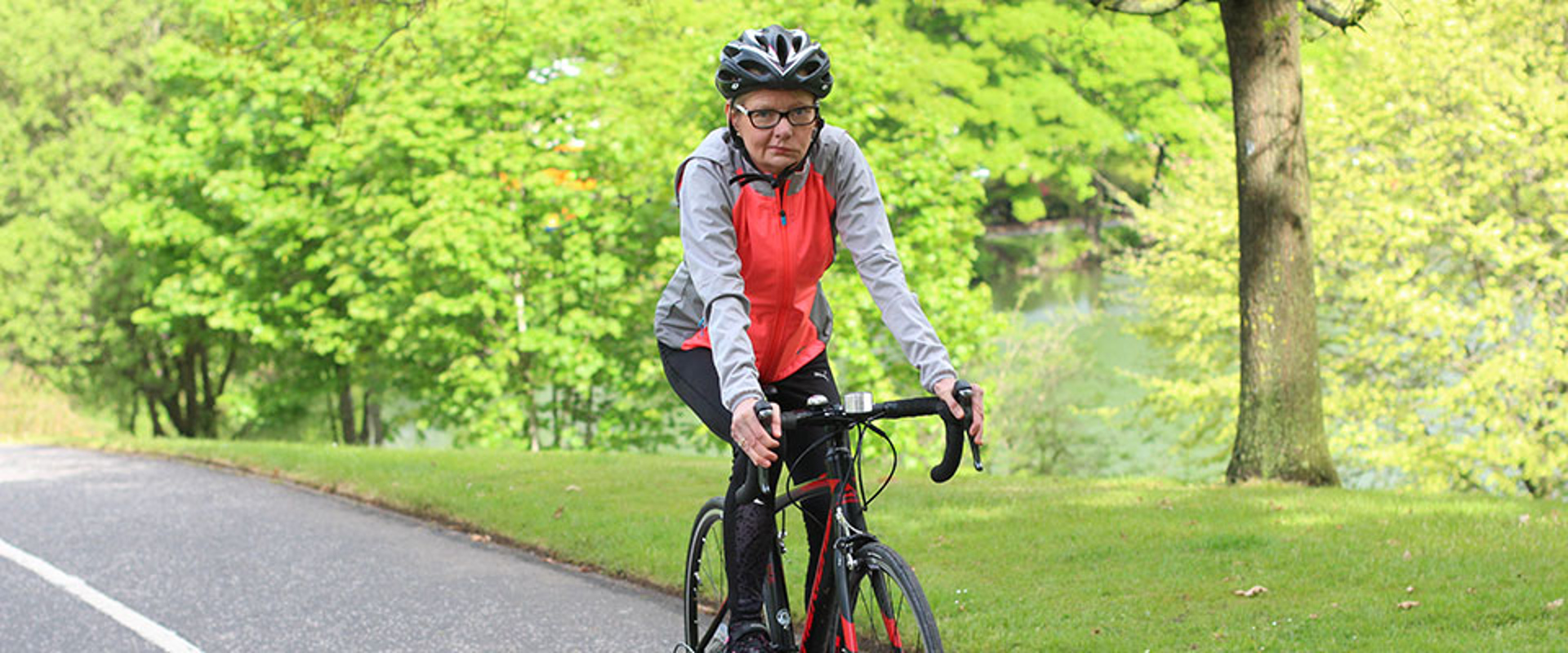 An image of a person cycling a bicyle